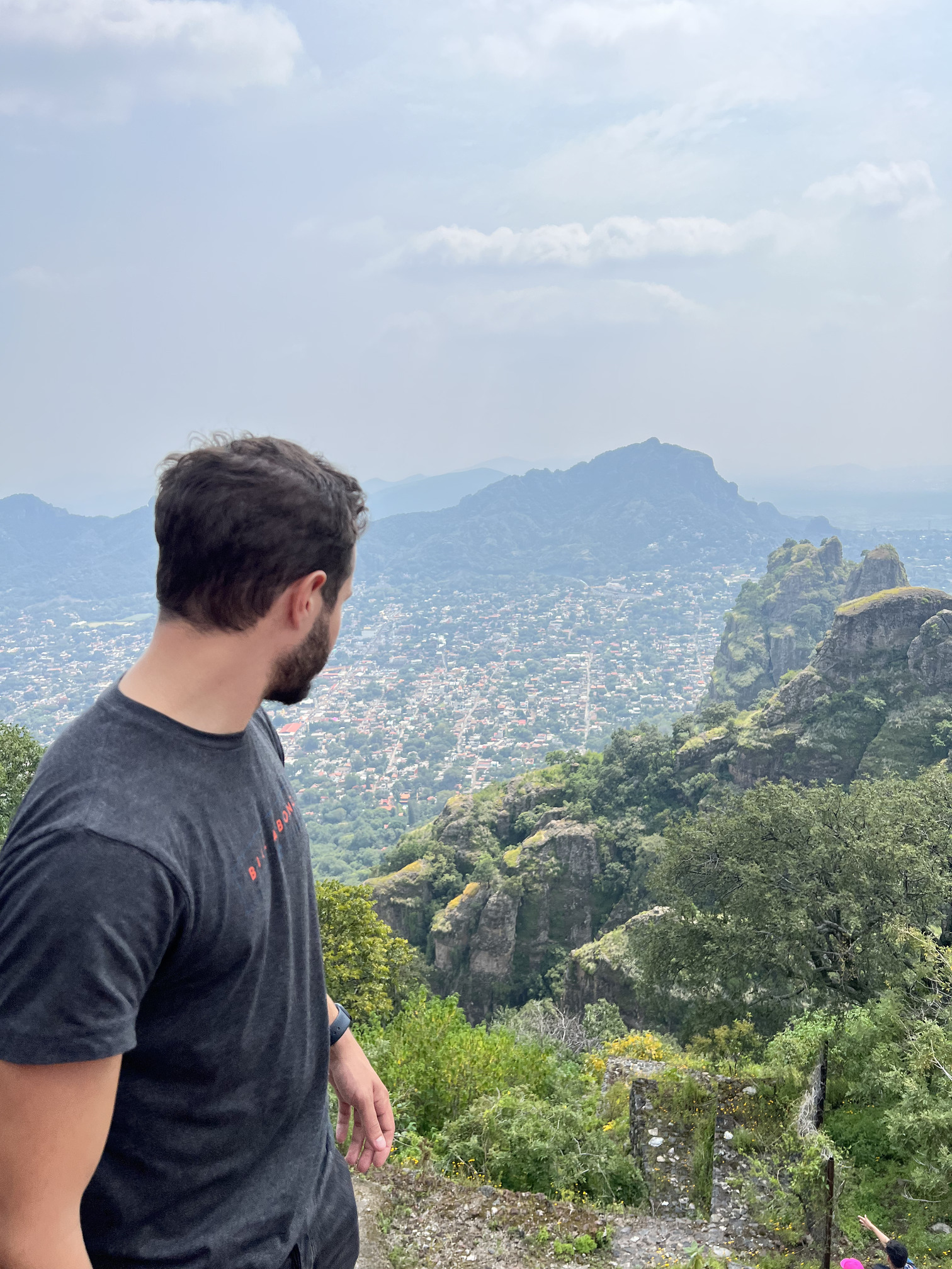 High-angle shot of the town nestled in the mountains, showcasing the beautiful landscape seen on Tepoztlan tours